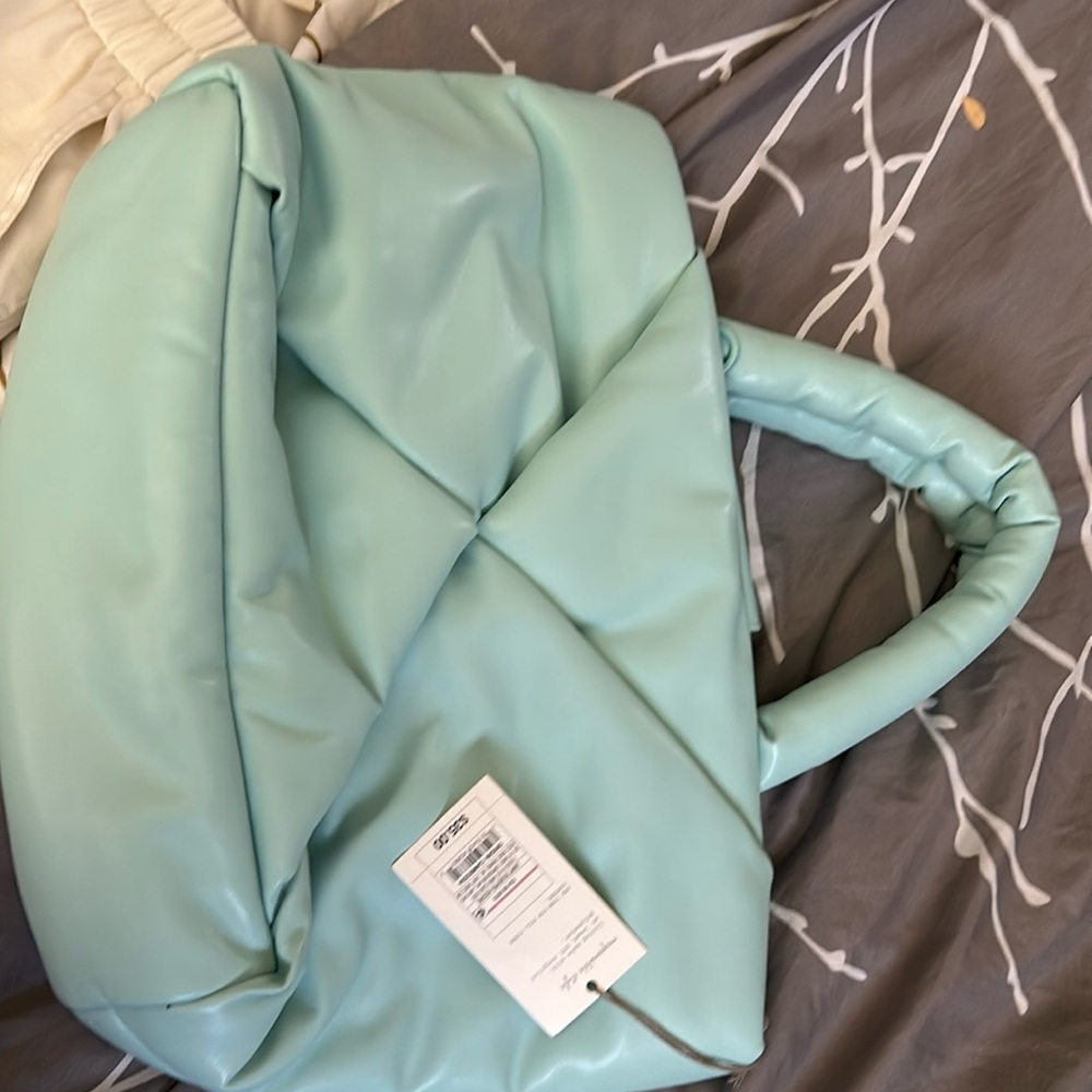 A new day light blue purse